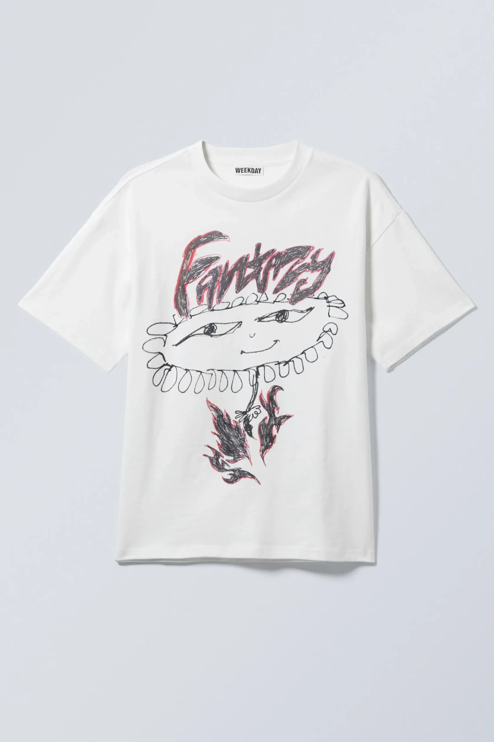 en_boxig_grafisk_tshirt_med_tryck_2-4.webp Weekday Graphics | T-Shirtar & Toppar<EN BOXIG, GRAFISK T-SHIRT MED TRYCK