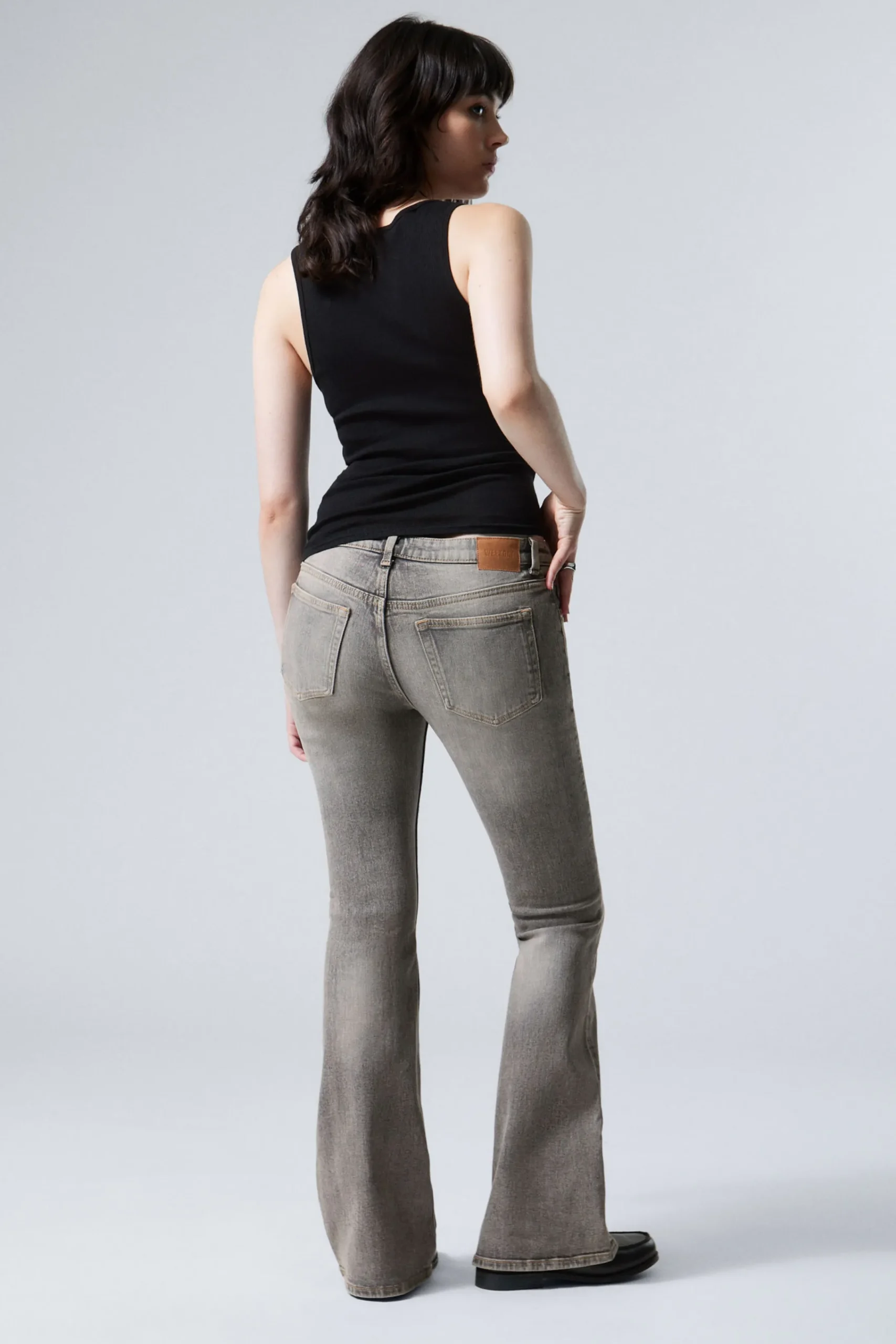 flame_low_waist_slim_flared_leg_jeans_3-4.webp Weekday Jeans<FLAME LOW WAIST SLIM FLARED LEG JEANS