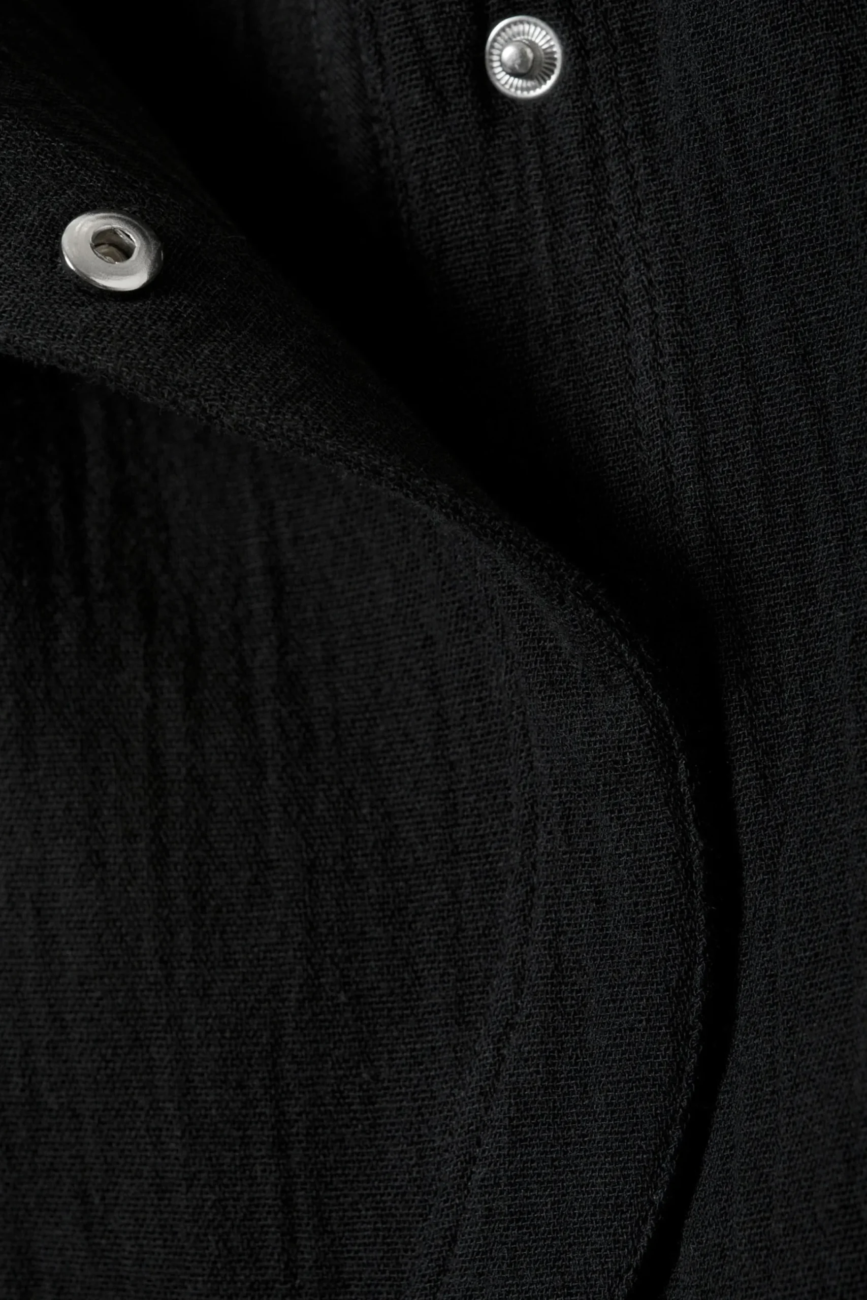 rmls_asymmetrisk_peplum_topp_4-1.webp Weekday Toppar<ÄRMLÖS ASYMMETRISK PEPLUM TOPP